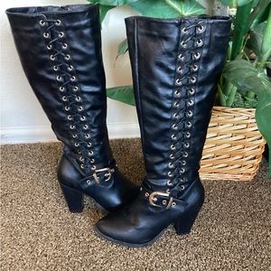 Black Western knee boots with gold buckles and gold trim. 16” calves